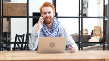 Man Talking on Phone at Workの写真素材
