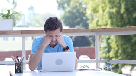 Tired Man Sleeping at Work, Outdoor Daydreamingの写真素材