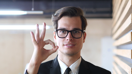 Satisfaction, Okay  Sign by Man in Suitの写真素材