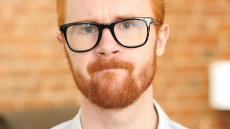 Stressful job, Tense ed Hair Beard Young Man in Glassesの写真素材