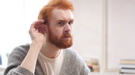 Man Listening Secret Carefullyの写真素材