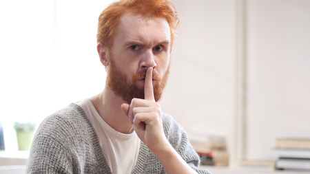 Silent, Silence Gesture by Man with Red Hairsの写真素材