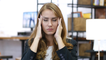 Headache, Work Overload, Stressed Girl at Work in Officeの写真素材