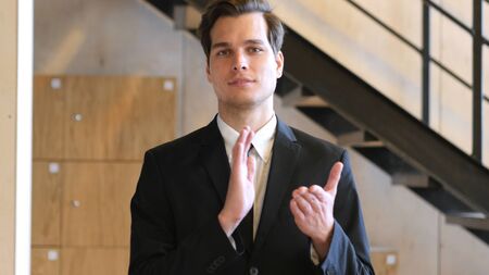 Applauding, Clapping Businessman for Teamの写真素材