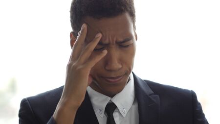 Stressed, Frustrated, Upset, Tense Businessman with Headache in Officeの写真素材
