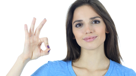 Ok Sign by Young Woman, White Backgroundの写真素材