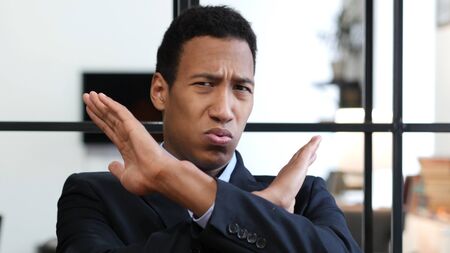 Rejecting, Disliking Gesture by Black Businessmanの写真素材