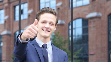 Thumbs Up for Success by Businessmanの写真素材