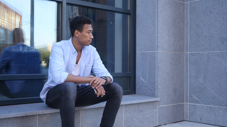 Outdoor Waiting Young Black Handsome Manの写真素材
