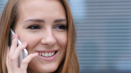 Close Up of Girl Face Talking on Phoneの写真素材