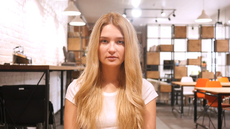 Portrait of Beautiful Blonde Girl, Looking in Cameraの写真素材