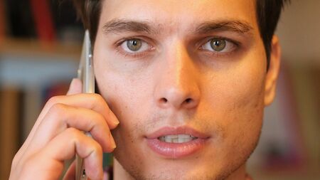 Close up of Man Talking on Phoneの写真素材