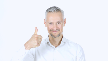Thumbs Up By Middle Aged Businessman , White Backgroundの写真素材