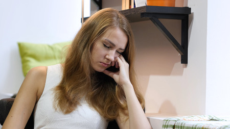 Beautiful Girl Sleeping at Work, Sitting tiredの写真素材