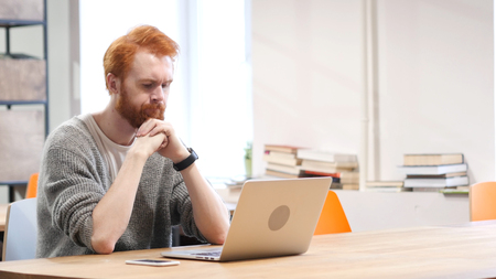 Man Waiting at Work, Sitting and Thinkingの写真素材