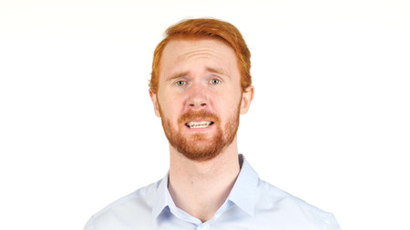 Crisis in the job as a young businessman reacts , look of desperation , shockedの写真素材