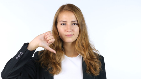 Thumbs Down By Businesswoman , Beautiful Girl , Portrait, White backgroundの写真素材