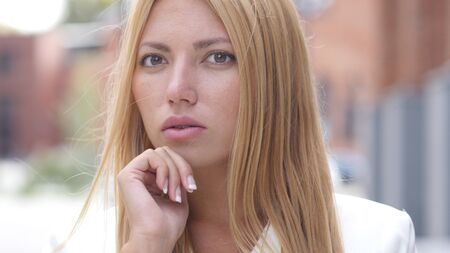 Close Up of Thinking Pensive Female, Outdoorの写真素材