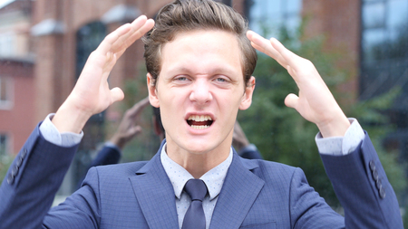 Screaming Aggressive Angry Young Businessmanの写真素材