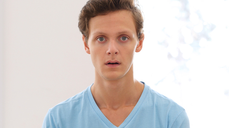 Astonisihed and Shocked Young Man, Amazed, Portraitの写真素材
