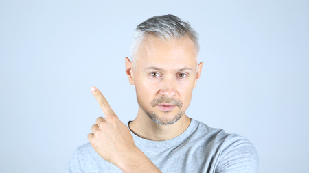 Middle Aged Man Pointing At Side, Copy Spaceの写真素材