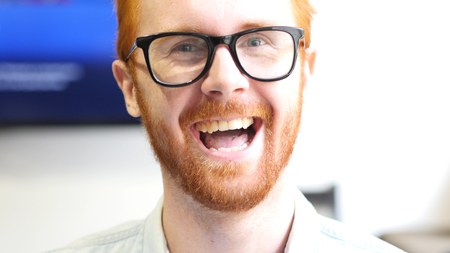 Laughing Red Hair Beard Young Man Faceの写真素材