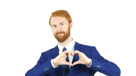 Heart Sign by Red Hair Beard Businessman, White Backgroundの写真素材