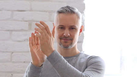 Applauding, Clapping Middle Aged Man Sitting in Office