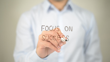 Focus On Success , man writing on transparent screenの写真素材
