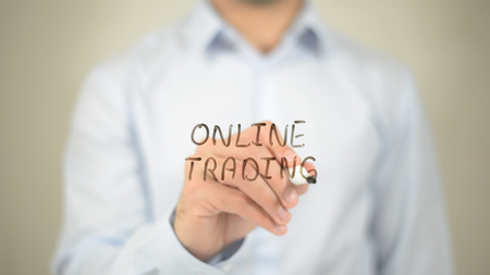 Online Trading , writing on transparent wallの写真素材