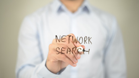 Network Search, man writing on transparent screenの写真素材