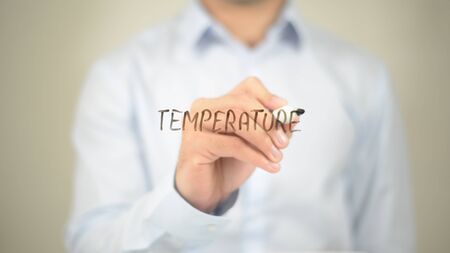Temperature, Man Writing on Transparent Screenの写真素材