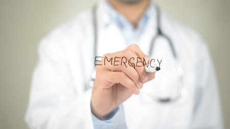Emergency, Doctor writing on transparent screenの写真素材