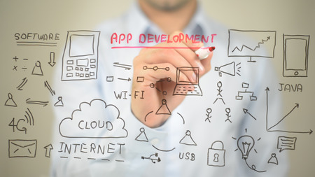 App Development Concept Illustration,  Man writing on transparent screenの写真素材