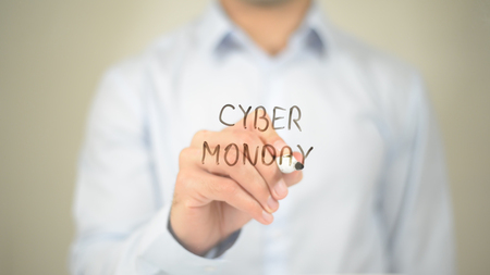 Cyber Monday, Man writing on transparent screenの写真素材