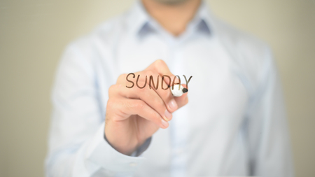 Sunday, Man Writing on Transparent Screenの写真素材