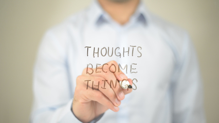 Thoughts Become Things, Man Writing on Transparent Screenの写真素材