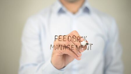 Feedback Management, writing on transparent screenの写真素材
