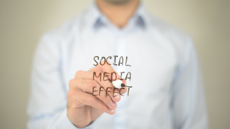 Social Media Effect,  Man writing on transparent screenの写真素材