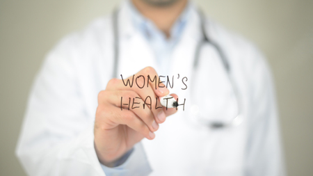 Women's Health, Doctor writing on transparent screenの写真素材