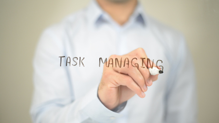 Task Managing, Man Writing on Transparent Screenの写真素材