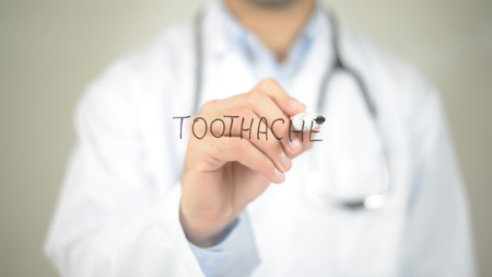 Tooth Ache , Doctor writing on transparent screenの写真素材