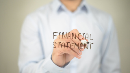Financial Statement, man writing on transparent screenの写真素材