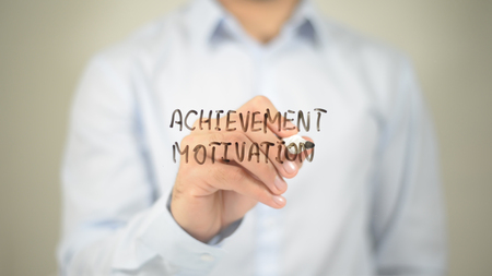 Achievement Motivation  , writing on transparent wallの写真素材
