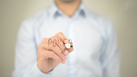 Poker , man writing on transparent screenの写真素材