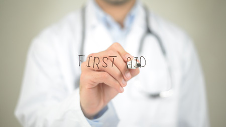 First Aid, Doctor writing on transparent screenの写真素材