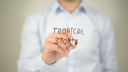 Tropical Storm , man writing on transparent screenの写真素材