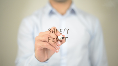 Safety First,  Man writing on transparent screenの写真素材
