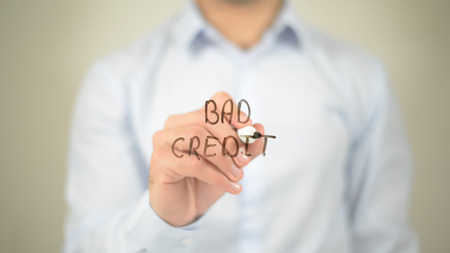 Bad Credit , man writing on transparent screenの写真素材