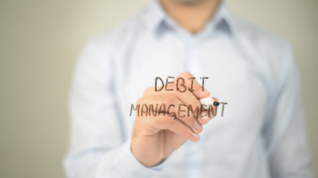 Debt Management, man writing on transparent screenの写真素材